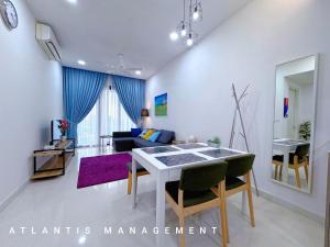 a living room with a table and a couch at KL Eco City Luxury 2 Bedrooms Apartment, Walking Distance to Mid Valley & The Garden & LRT in Kuala Lumpur