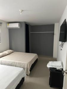 Postel nebo postele na pokoji v ubytování HOTEL IBIZA