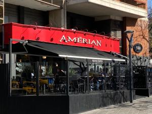 a restaurant with tables and chairs in front of a building at Amérian Córdoba Park Hotel in Córdoba