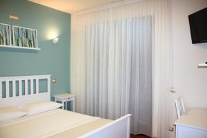 Postel nebo postele na pokoji v ubytování SIGIS HOTEL - Fiumicino