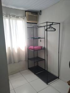 a black shelf in a room with a window at Lapa Casa Hostel in Rio de Janeiro