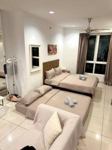 a hotel room with two beds and a couch at Mansion One Modern 5pax walking distance Gleneagles Hospital Gurney Plaza in George Town +36 photos