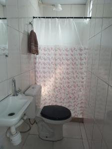 a bathroom with a toilet and a sink and a shower at Lapa Casa Hostel in Rio de Janeiro +34 photos