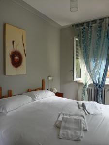 Giường trong phòng chung tại Locanda Ostu di San giacu