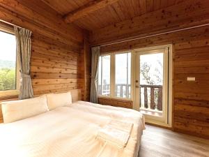 Ліжко або ліжка в номері Dingdai Glass Villa