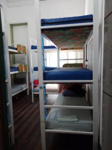 a group of bunk beds in a room at Lapa Casa Hostel in Rio de Janeiro