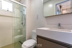 a bathroom with a toilet and a sink and a shower at Sophisticated fit with 3 suites Jurere LES403 in Florianópolis +21 photos