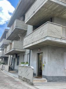 a building with balconies on the side of it at Casa ORI in Montesilvano +20 photos