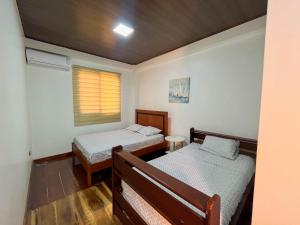 Postel nebo postele na pokoji v ubytování Casa vacional de playa Santorini