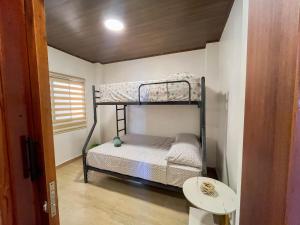 Postel nebo postele na pokoji v ubytování Casa vacional de playa Santorini