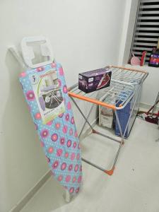 a snowboard on a rack next to a table at Best Appartment in Al Khuwair in Bawshar