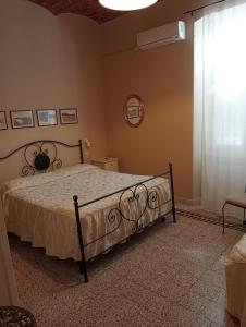 Postel nebo postele na pokoji v ubytování Buonanotte Rooms