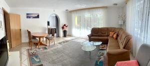 a living room with a couch and a table at Haus Mantai in Freudenstadt
