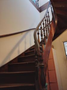 a wooden spiral staircase in a building at Lapa Casa Hostel in Rio de Janeiro