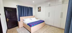 Una cama o camas en una habitación de LC Lodge & Event Centre