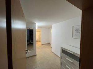 a hallway with a door leading to a room at Appartement FlexiHome Garbe in Hüsten