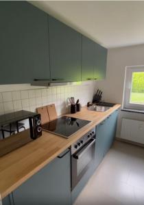 Kuchyň nebo kuchyňský kout v ubytování Appartement FlexiHome Garbe