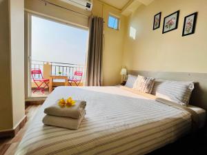 Voodi või voodid majutusasutuse Aizawl Guest House Apartments toas