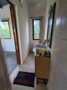 Una cama o camas en una habitación de Chambre chez l'habitant située à 200m de la plage