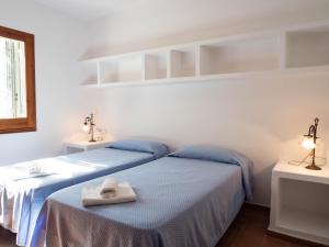 Posteľ alebo postele v izbe v ubytovaní Casa Sa Serreta
