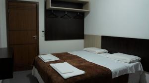 Postel nebo postele na pokoji v ubytování Hotel Tres Bandeiras