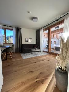 Posezení v ubytování Almappartement Nassfeld- Sonnenalpe