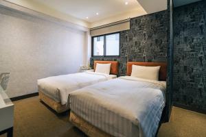 Letto o letti in una camera di Hotel Puri Taipei Station Branch