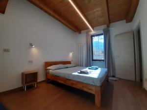 Postel nebo postele na pokoji v ubytování Alloggio Vinadio