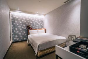 Letto o letti in una camera di Hotel Puri Taipei Station Branch
