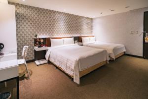 Letto o letti in una camera di Hotel Puri Taipei Station Branch