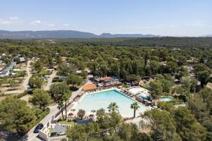 an aerial view of a resort with a swimming pool at Camping RCN Domaine de la Noguière in Le Muy