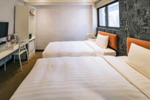 Letto o letti in una camera di Hotel Puri Taipei Station Branch