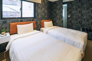 Letto o letti in una camera di Hotel Puri Taipei Station Branch