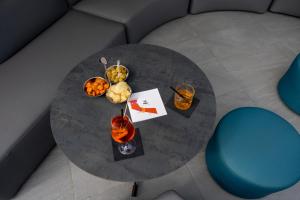 a round table with food and drinks on it at The Aries Hotel in Vicenza