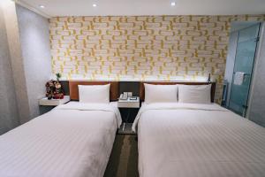 Letto o letti in una camera di Hotel Puri Taipei Station Branch