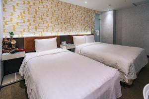 Letto o letti in una camera di Hotel Puri Taipei Station Branch