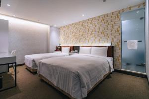 Letto o letti in una camera di Hotel Puri Taipei Station Branch
