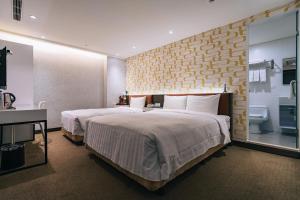 Letto o letti in una camera di Hotel Puri Taipei Station Branch