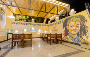 a restaurant with a large mural of a woman at Samara Guest House in Aswan