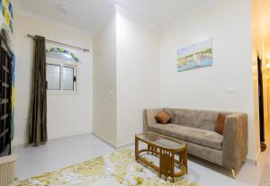 a living room with a couch and a table at Samara Guest House in Aswan