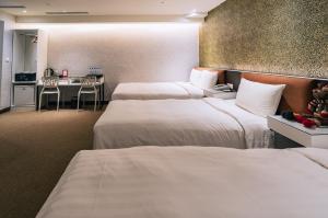 Letto o letti in una camera di Hotel Puri Taipei Station Branch