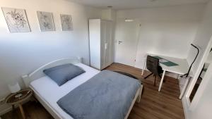 Katil atau katil-katil dalam bilik di Wohnung am Weinberg Ahnatal