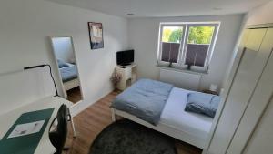 Katil atau katil-katil dalam bilik di Wohnung am Weinberg Ahnatal