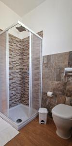 a bathroom with a shower and a toilet at Casa Vacanze Rebecca in Pula +20 photos