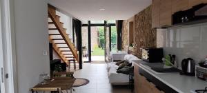 a room with a kitchen and a living room at O Cabanel in Fisterra