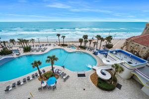 a view of a swimming pool and the ocean at Luxury 6th Floor 1 BR Condo Direct Oceanfront Wyndham Ocean Walk Resort Daytona Beach | 610 in Daytona Beach