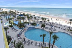 an aerial view of a resort with a pool and a beach at Luxury 6th Floor 1 BR Condo Direct Oceanfront Wyndham Ocean Walk Resort Daytona Beach | 610 in Daytona Beach
