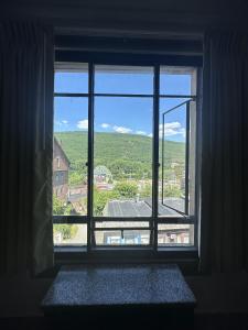 a window with a view of a green field at Latchis Hotel in Brattleboro