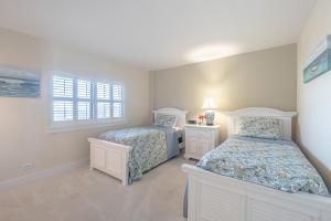 Postel nebo postele na pokoji v ubytování The Islander - 5E by Sea Scape Properties