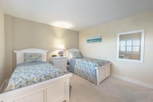 Postel nebo postele na pokoji v ubytování The Islander - 5E by Sea Scape Properties + 19 fotografií